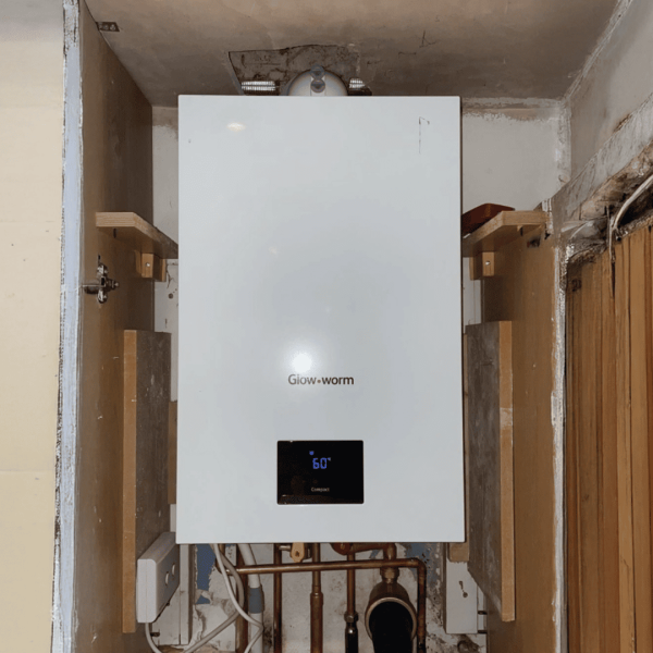 Glow Worm white combi boiler on the wall inside a cupboard in a Wimbledon, South London property