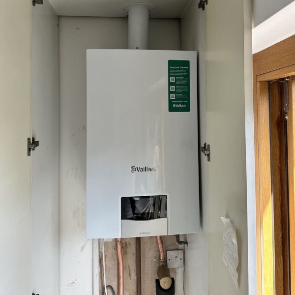 New Vaillant ecotec plus combi boiler installed in a cupboard at a home in Wandsworth by The London Plumbing Company