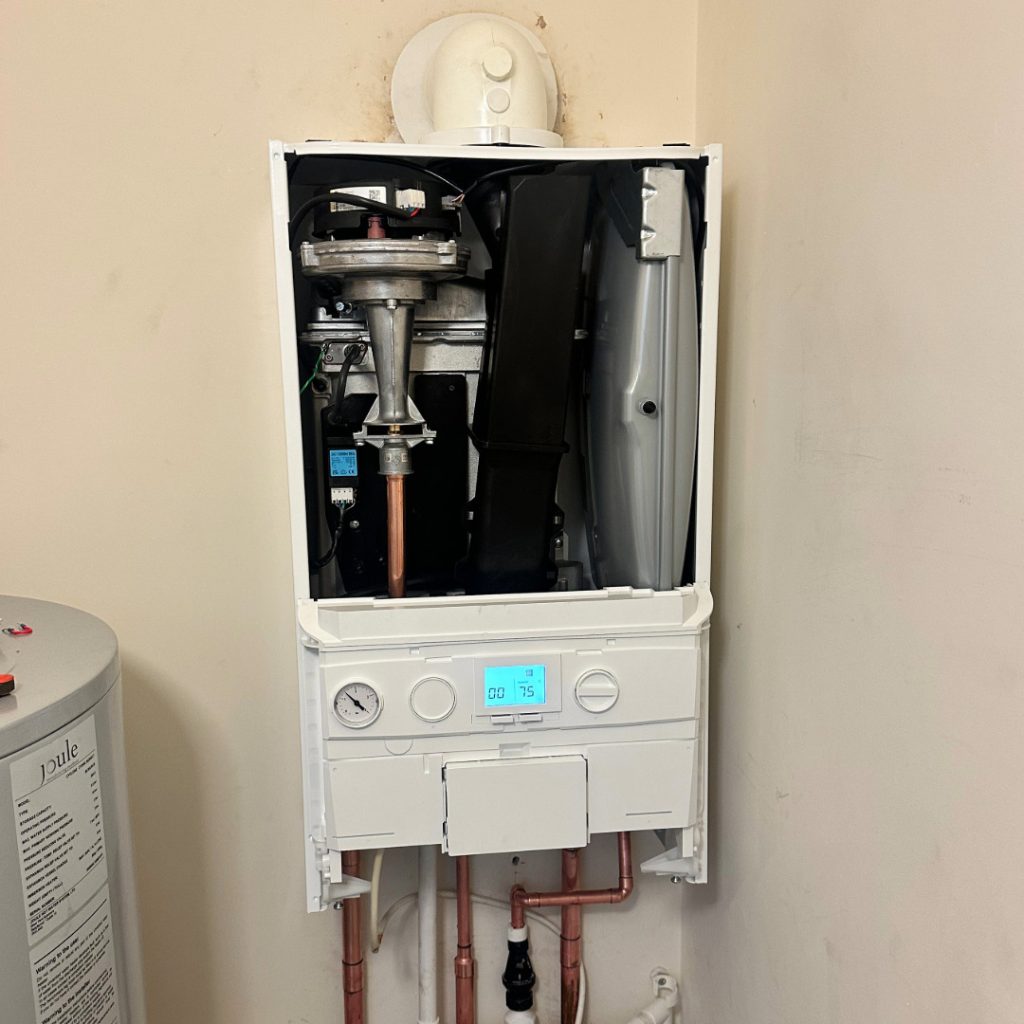 The inside mechanics of a boiler under repair in a South London home